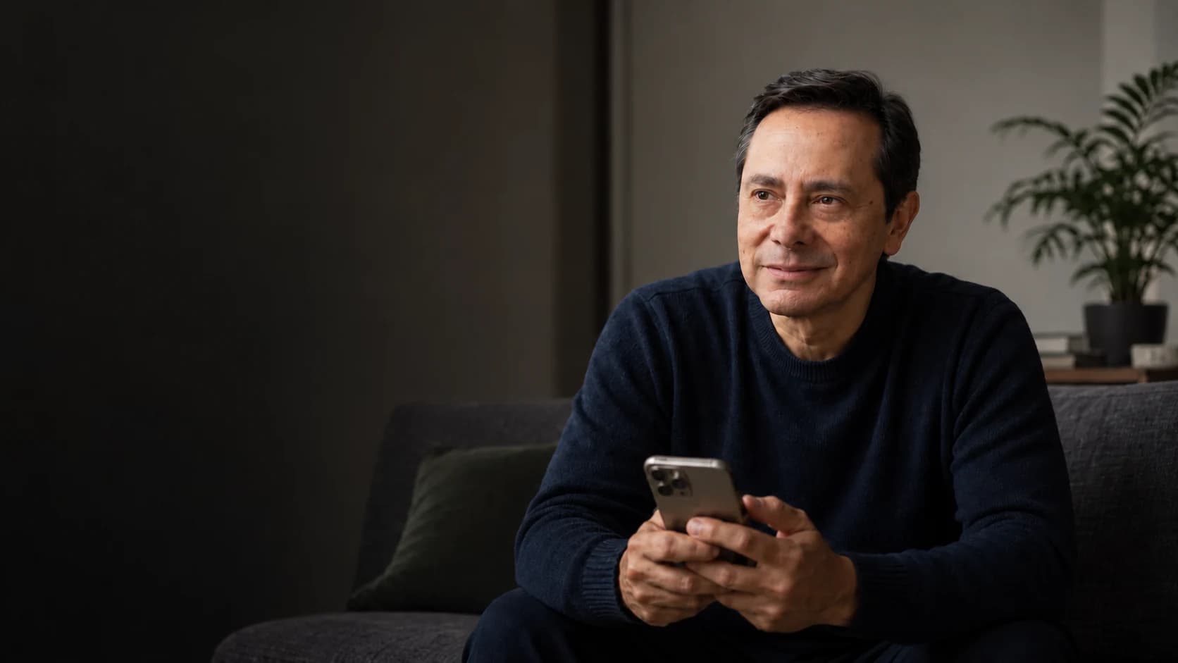 Walter Calvo holding a phone in a quiet, reflective setting